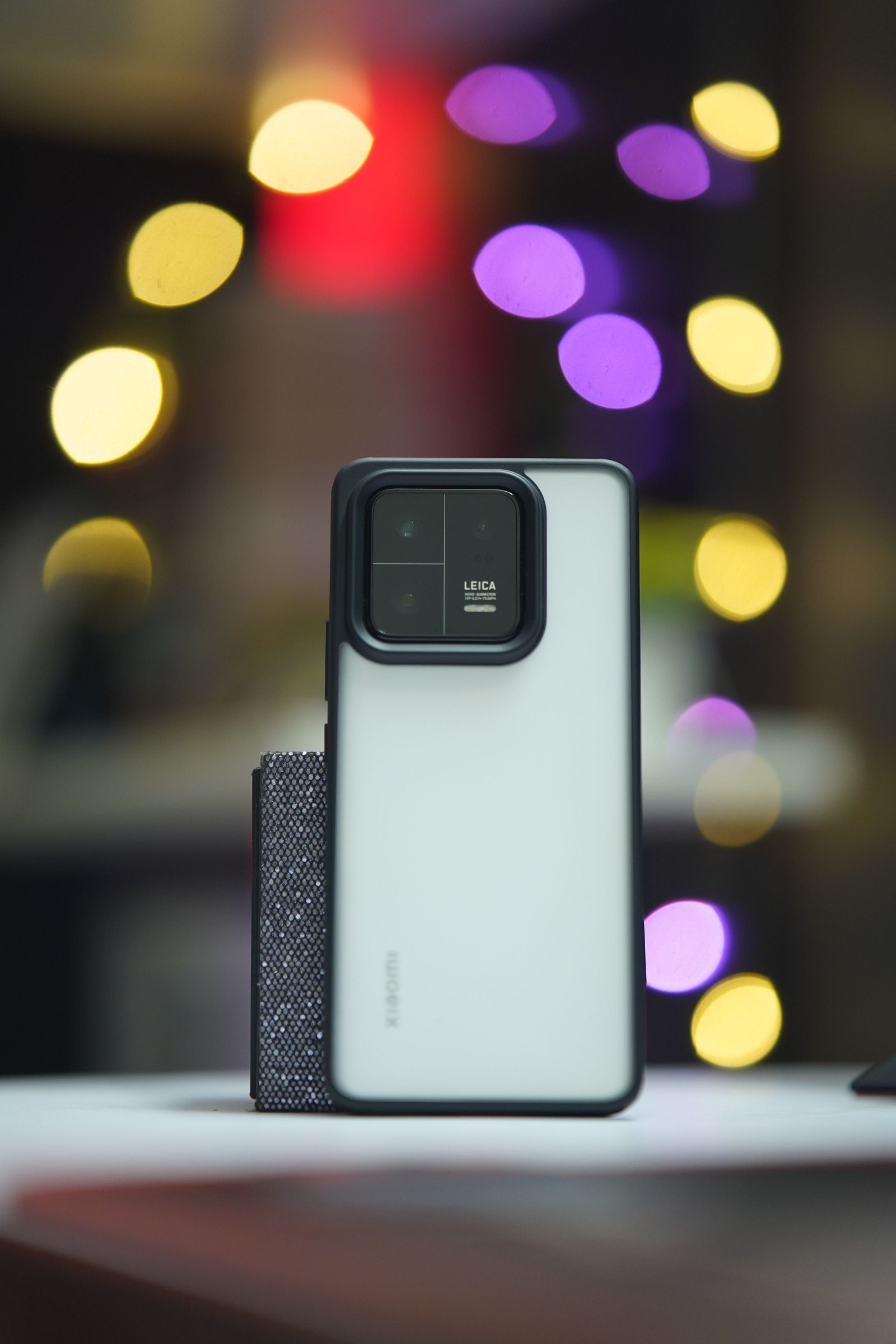 Stylish smartphone framed by colorful release lights